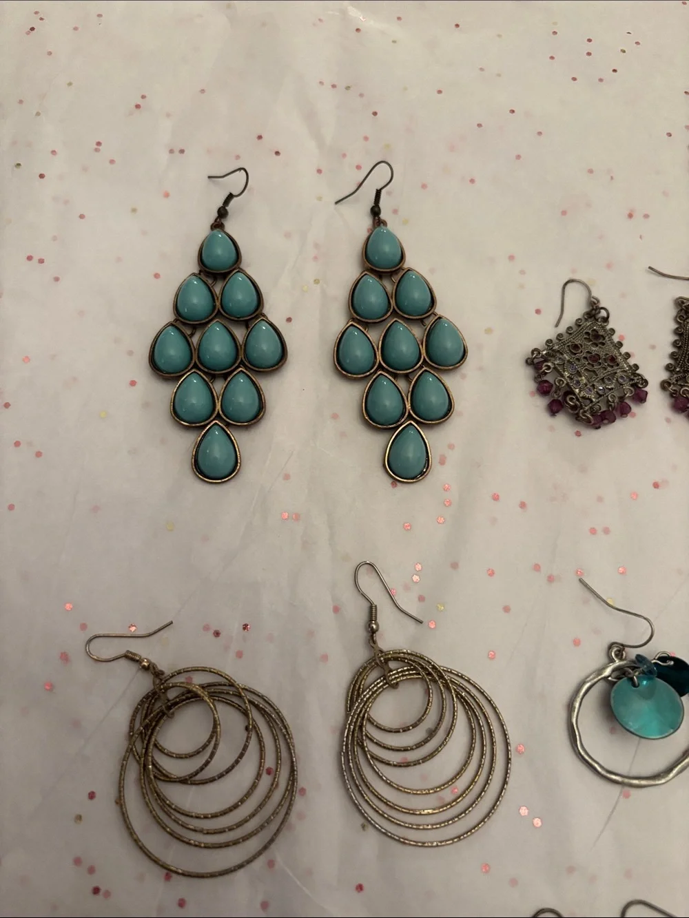 10 pair of assorted‎ earrings.
